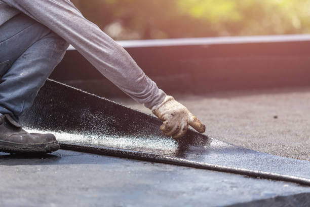 Professional Waterproofing technician working in Burton, MI